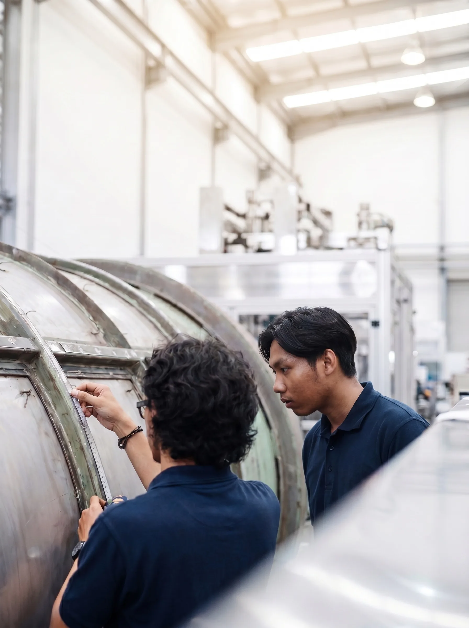 BMT engineers inspecting machine
